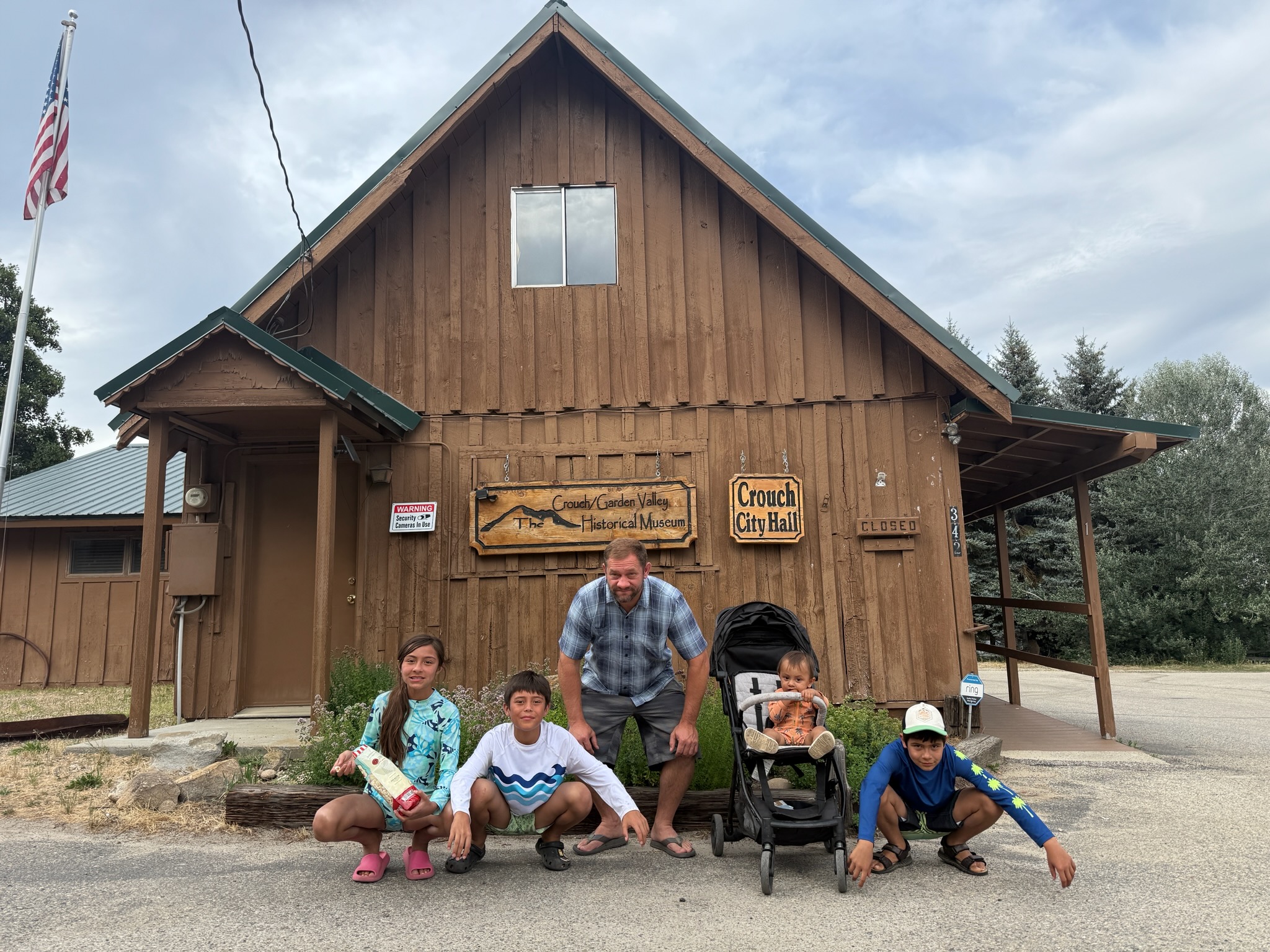 Isaac LeBaron with family outside a historic building